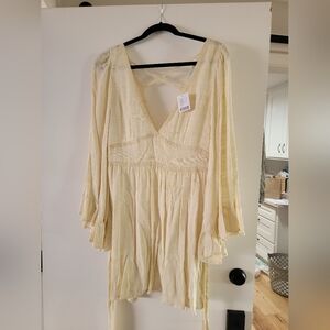 Flowy Cream Dress with V-Neck